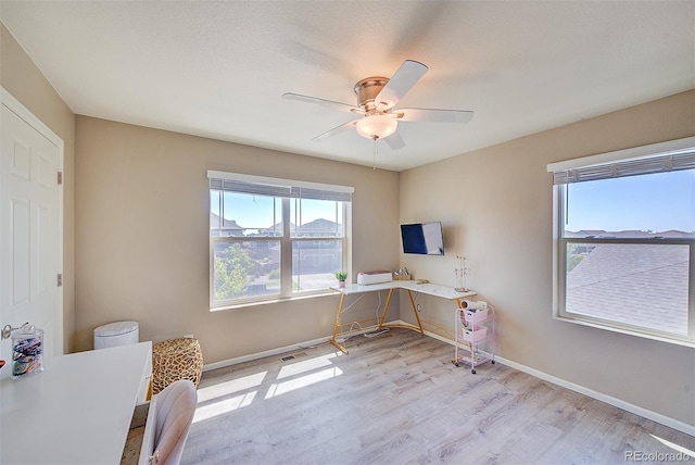 office area featuring ceiling fan and light hardwood / wood-style flooring