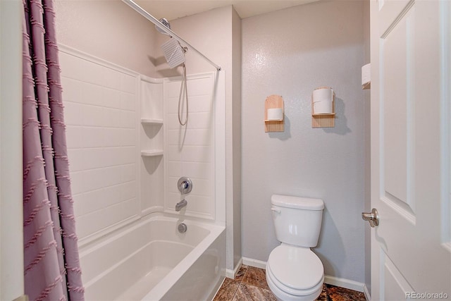 bathroom with toilet and  shower combination