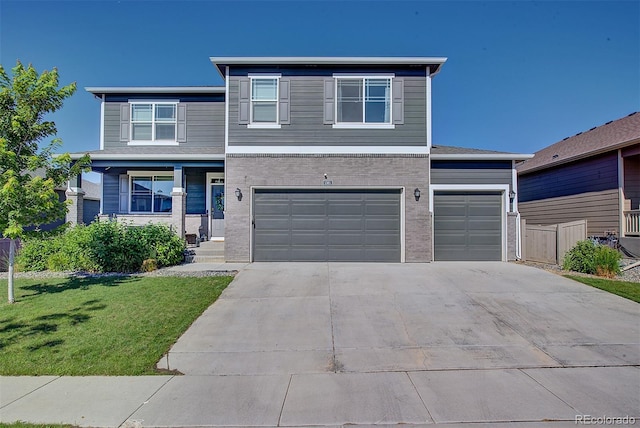 view of front of house with a front yard and a garage