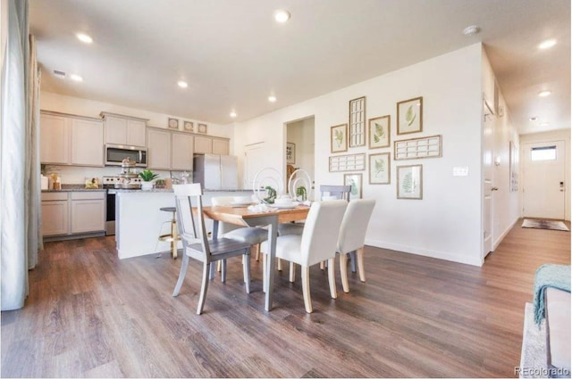 dining area with dark wood-type flooring