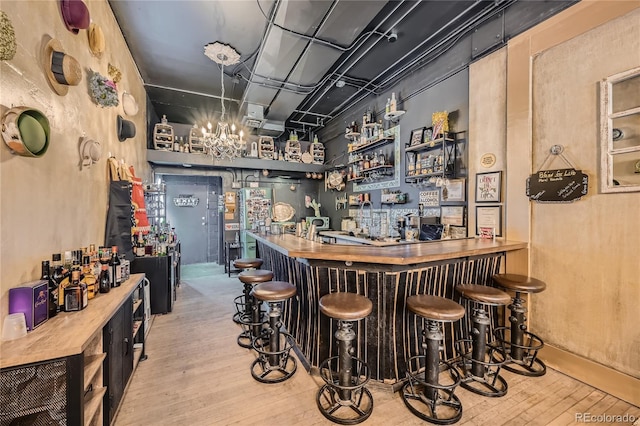 bar featuring light wood-type flooring