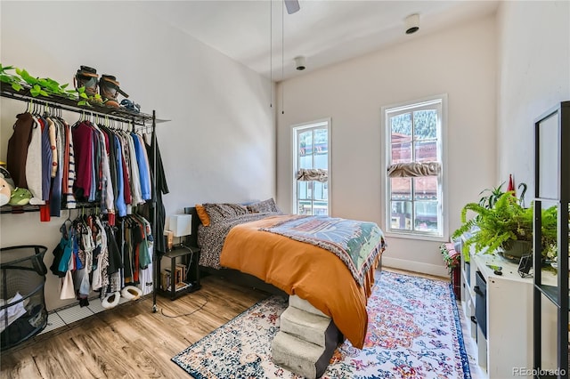 bedroom featuring ceiling fan and light hardwood / wood-style flooring