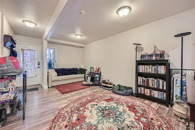 interior space featuring a textured ceiling and light wood-type flooring