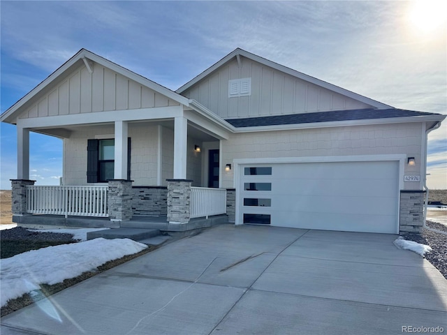 view of front of house with a garage and covered porch