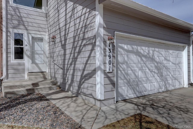 exterior space featuring entry steps and a garage