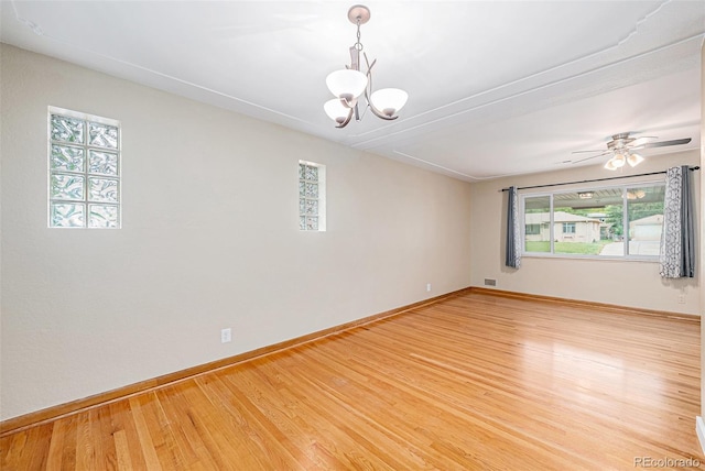 260 Flint Way, Broomfield, CO 80020 - spare room featuring a chandelier, baseboards, light wood-style floors, and attic access
