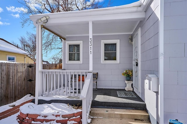 doorway to property featuring a porch