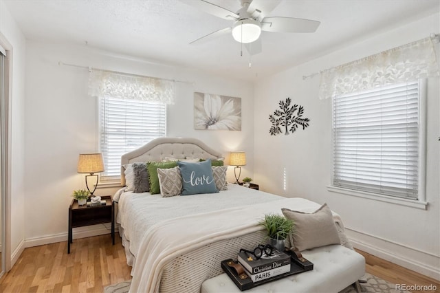 bedroom with hardwood / wood-style flooring and ceiling fan