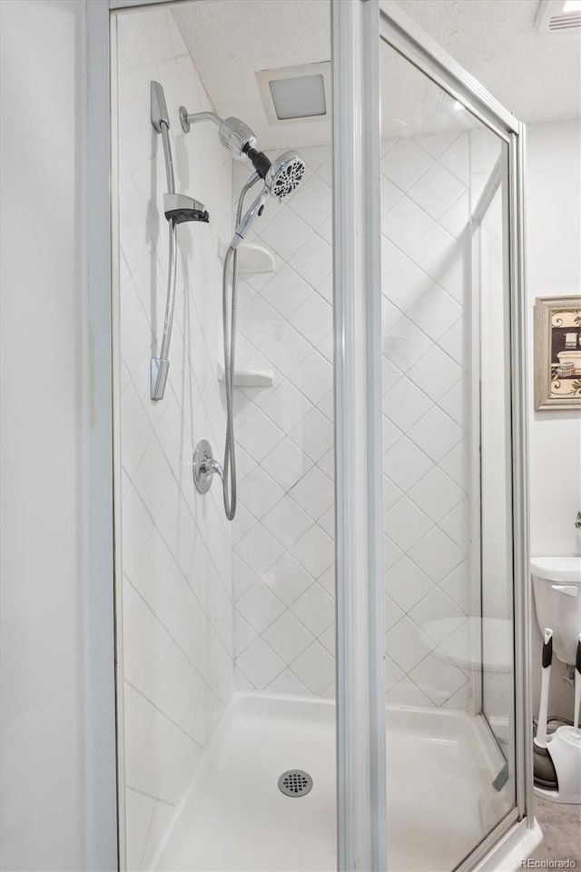 bathroom featuring an enclosed shower