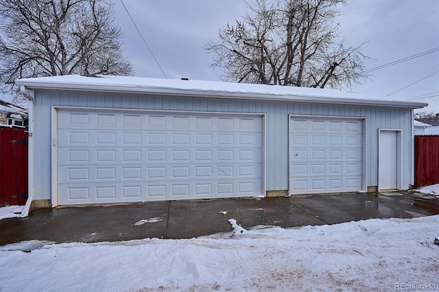 view of snow covered garage