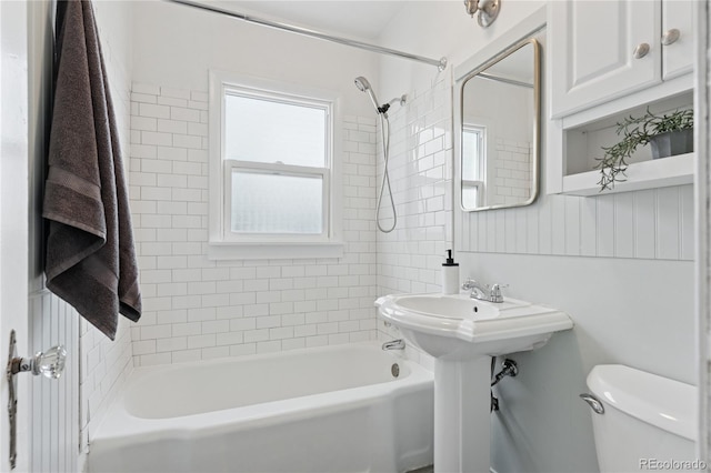 bathroom featuring toilet and bathtub / shower combination