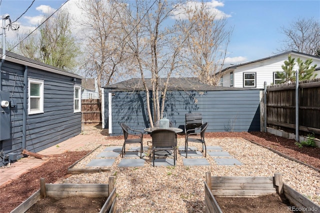 view of patio with a fenced backyard and a garden