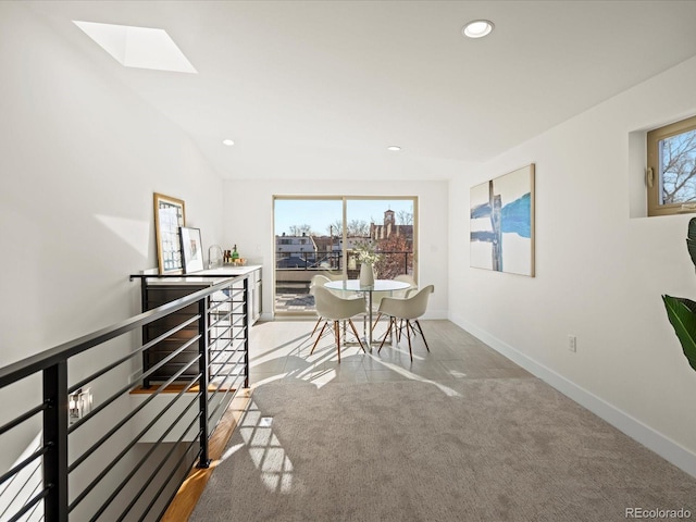 carpeted dining room with recessed lighting, a healthy amount of sunlight, and baseboards