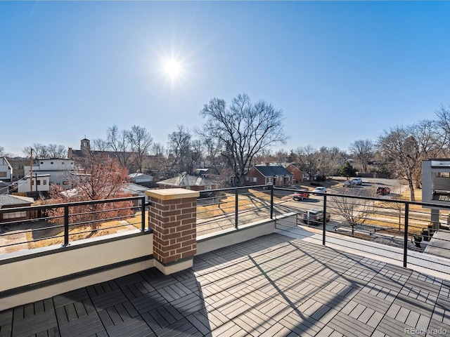 wooden terrace featuring a residential view