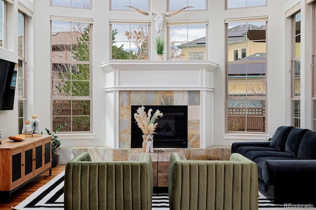 8044 E 24th Ave, Denver, CO 80238 - living room featuring a premium fireplace and wood finished floors