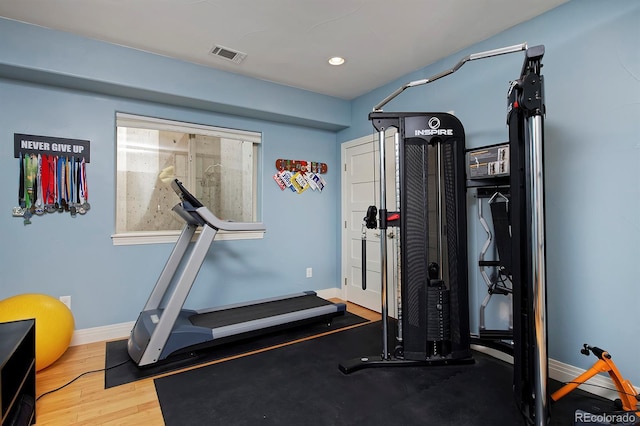 8044 E 24th Ave, Denver, CO 80238 - workout room with baseboards, recessed lighting, and wood finished floors