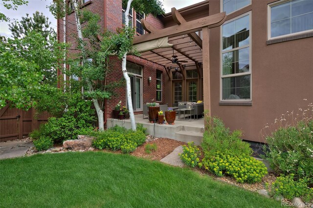 8044 E 24th Ave, Denver, CO 80238 - back of property with ceiling fan, a patio, brick siding, and stucco siding