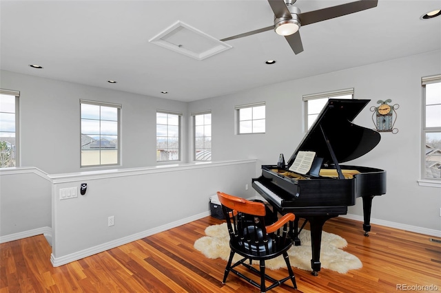8044 E 24th Ave, Denver, CO 80238 - sitting room with attic access, healthy amount of natural light, wood finished floors, baseboards, and recessed lighting