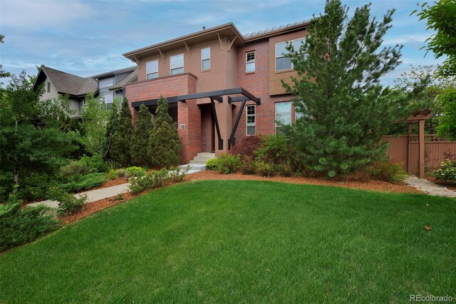 8044 E 24th Ave, Denver, CO 80238 - view of front of house with brick siding and stucco siding