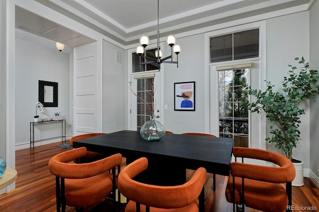 8044 E 24th Ave, Denver, CO 80238 - dining space featuring wood finished floors and a chandelier