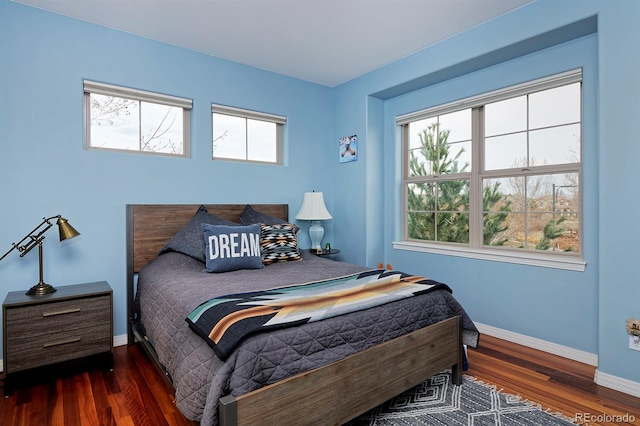 8044 E 24th Ave, Denver, CO 80238 - bedroom featuring baseboards and wood finished floors