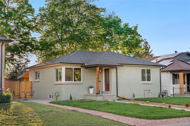 3541 Eudora St, Denver, CO 80207 - view of front of home featuring brick siding and roof with shingles