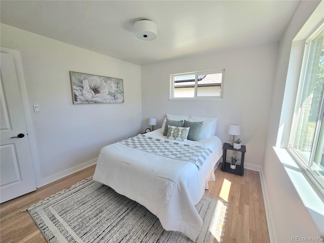 3541 Eudora St, Denver, CO 80207 - bedroom featuring light wood-type flooring and baseboards