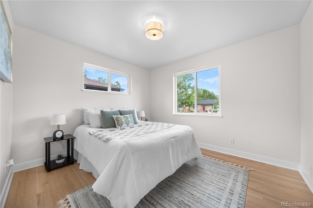 3541 Eudora St, Denver, CO 80207 - bedroom with baseboards and light wood finished floors