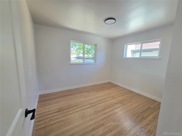 3541 Eudora St, Denver, CO 80207 - empty room with light wood-style floors and baseboards