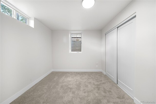 3541 Eudora St, Denver, CO 80207 - unfurnished bedroom with carpet flooring, baseboards, and a closet
