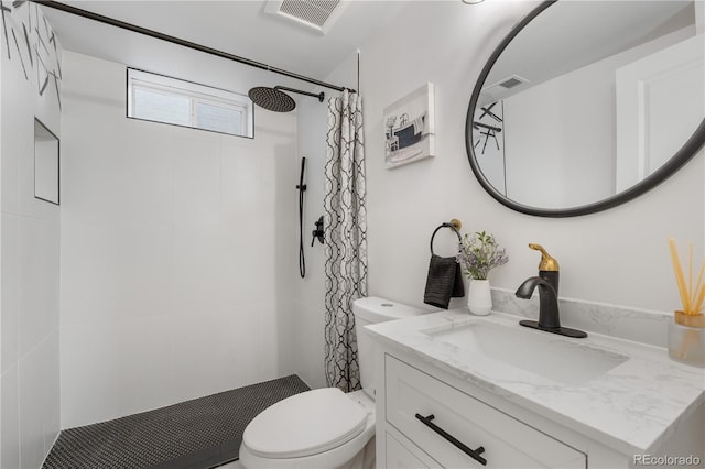 3541 Eudora St, Denver, CO 80207 - bathroom with toilet, vanity, and tiled shower