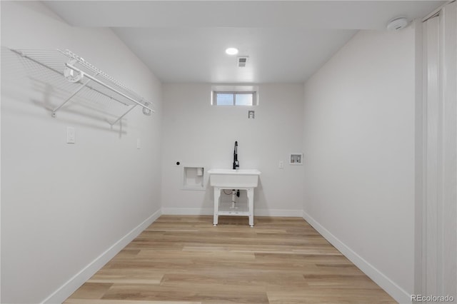 3541 Eudora St, Denver, CO 80207 - clothes washing area with hookup for a washing machine, electric dryer hookup, light wood-style floors, and baseboards