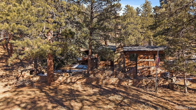 exterior space with a forest view