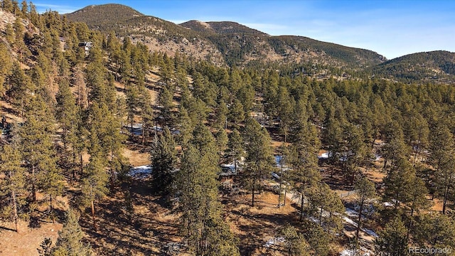 mountain view featuring a forest view