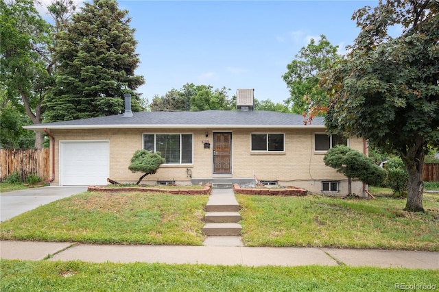 3054 S Raleigh St, Denver, CO 80236 - single story home featuring concrete driveway, an attached garage, brick siding, central air condition unit, and roof with shingles