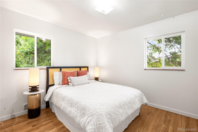 3054 S Raleigh St, Denver, CO 80236 - bedroom featuring baseboards and wood finished floors