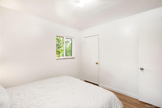 3054 S Raleigh St, Denver, CO 80236 - bedroom with light wood-style floors and baseboards