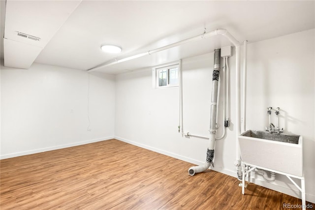 3054 S Raleigh St, Denver, CO 80236 - below grade area featuring wood finished floors and baseboards