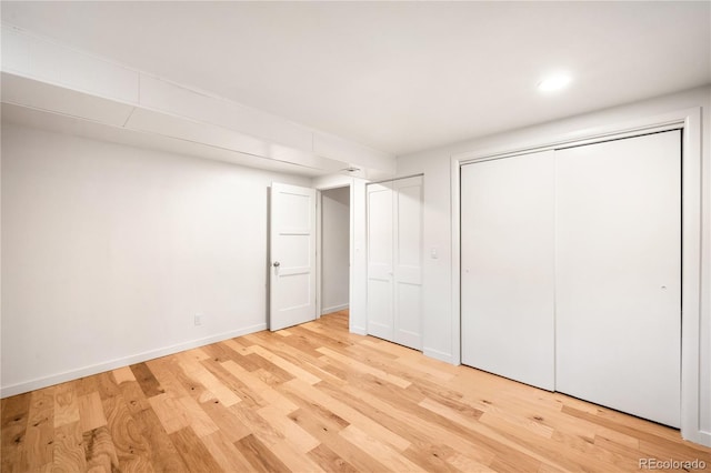 3054 S Raleigh St, Denver, CO 80236 - unfurnished bedroom featuring light wood finished floors, baseboards, a closet, and recessed lighting