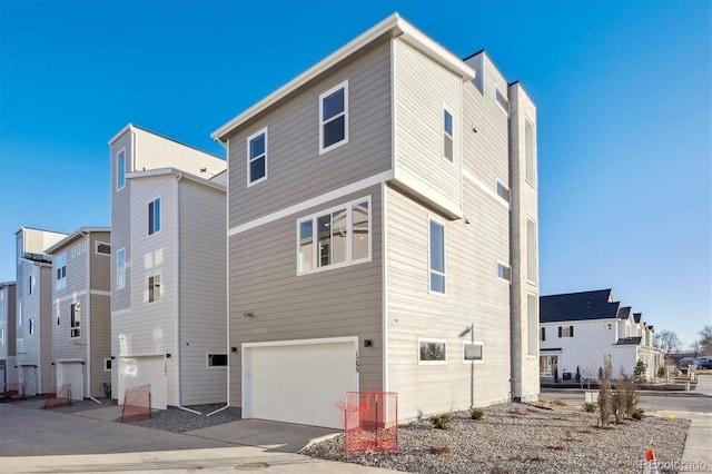 rear view of property with a garage