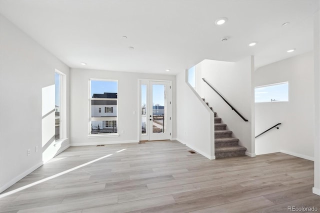 entrance foyer with light hardwood / wood-style floors