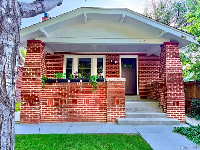 1477 Fairfax St, Denver, CO 80220 - view of front of property featuring brick siding and a chimney