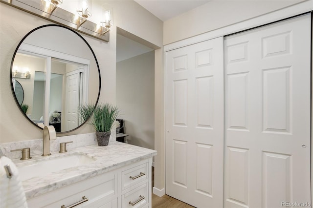 bathroom featuring wood finished floors and vanity