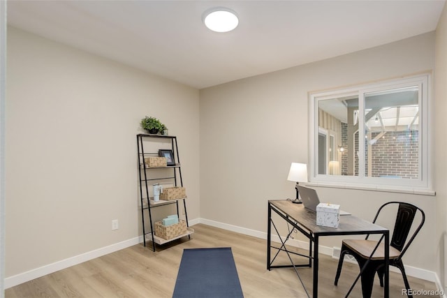 office space featuring light wood finished floors and baseboards
