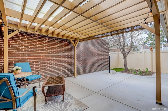 view of patio featuring fence