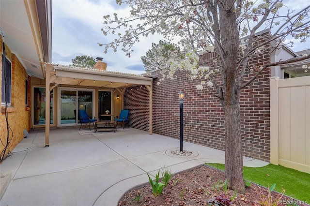 view of patio with fence