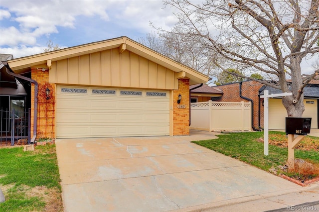 ranch-style home with board and batten siding, a garage, fence, brick siding, and driveway