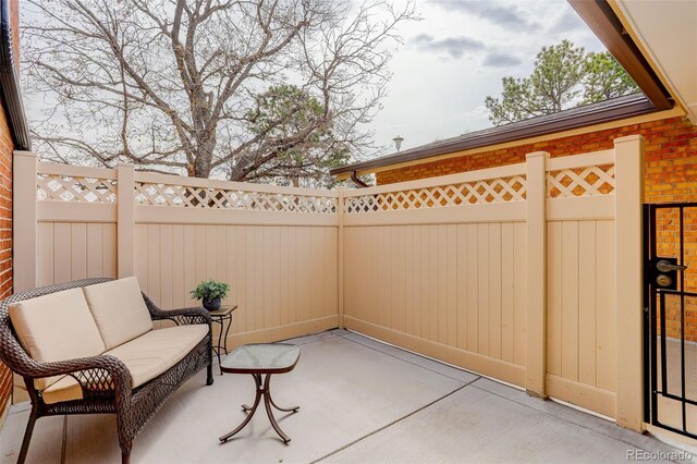 view of patio featuring outdoor lounge area and a fenced backyard