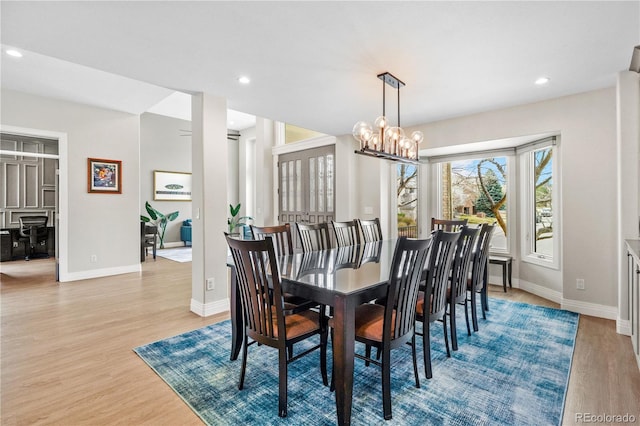 11465 W Atlantic Ave, Lakewood, CO 80227 - dining area featuring wood finished floors, baseboards, a chandelier, and recessed lighting