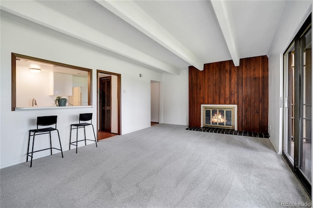 2525 S Dayton Way Unit 1510, Denver, CO 80231 - carpeted living area featuring beamed ceiling and a glass covered fireplace